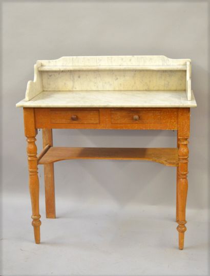 null Moulded pine dressing table with white marble top veined with grey. It opens...