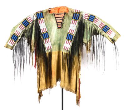 null Indian costume jacket in tanned leather decorated with black hair and polychrome...