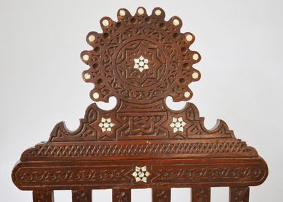 null A PAIR OF wooden complaint chairs inlaid with mother-of-pearl, with geometrical...
