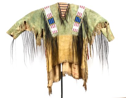 null Indian costume jacket in tanned leather decorated with black hair and polychrome...