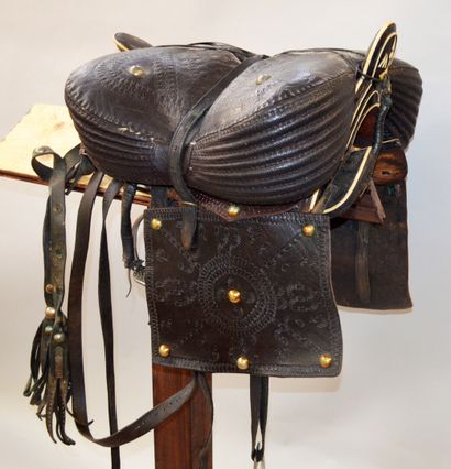 null Cossack saddle in black leather covered with a wooden core with ivory inlay...