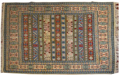 null IRAN 

A hand-knotted wool carpet decorated with juxtaposed geometric bands...