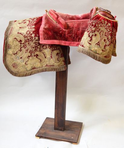 null SADDLE entirely covered with red velvet embroidered with flowery scrolls, foliage...