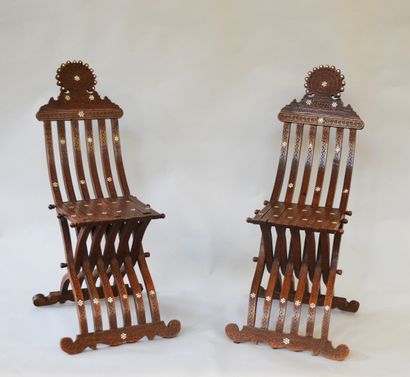 null A PAIR OF wooden complaint chairs inlaid with mother-of-pearl, with geometrical...