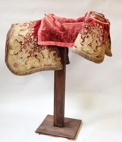 null SADDLE entirely covered with red velvet embroidered with flowery scrolls, foliage...