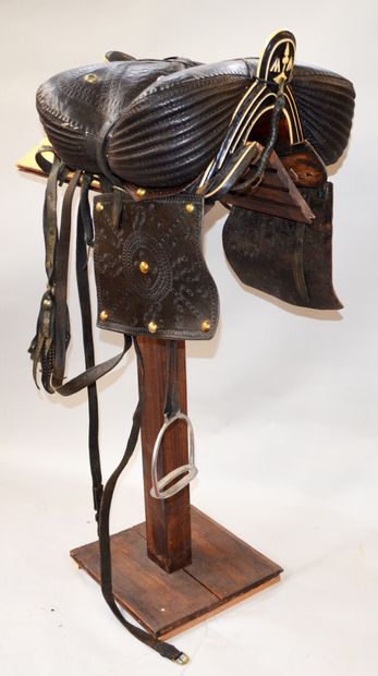 null Cossack saddle in black leather covered with a wooden core with ivory inlay...