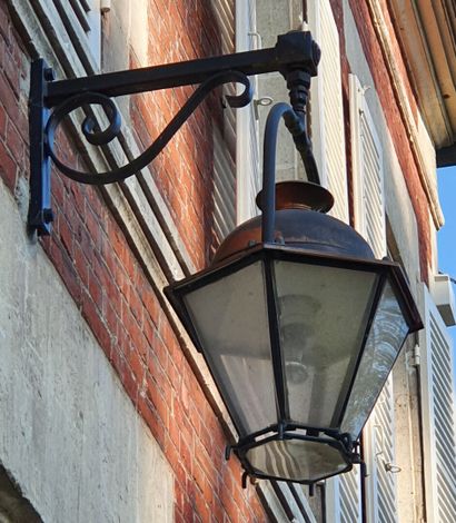 null Outdoor Lantern model "Beaugency", the wrought iron frame surmounted by an aged...