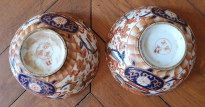 null Pair of porcelain BOWLS with IMARI decoration of birds on pots containing peony...