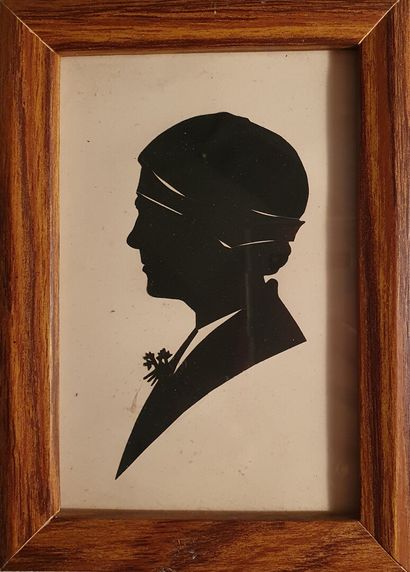 null Meeting of two PAPER CUT-outs showing a profile of a man with a hat and a woman...