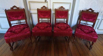 null Suite of four moulded oak CHAIRS, the straight backs with carved handles decorated...