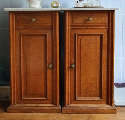 null Pair of moulded oak CHEVETS opening by a drawer and a full door - White marble...