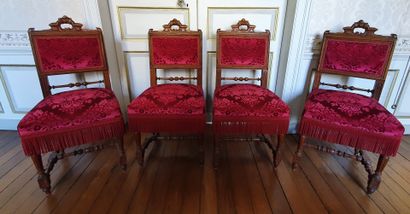 null Suite of four moulded oak CHAIRS, the straight backs with carved handles decorated...