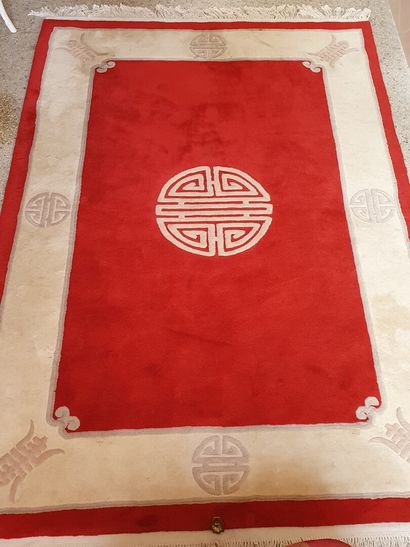 null CHINA 

WOOL RUG decorated with the Shou sign (symbol of longevity and prosperity)...