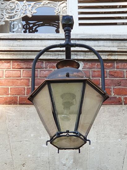 null Outdoor Lantern model "Beaugency", the wrought iron frame surmounted by an aged...
