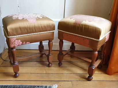 null Pair of TABOURETS resting on four turned oak legs linked by an H-shaped brace...