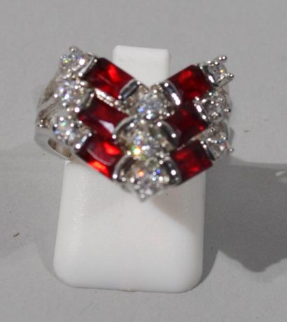 null 925/1000 silver ring set with white imitation stones and red baguette cut stones...