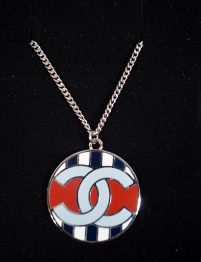 null CHANEL 

Round pendant with navy blue and white stripes and chanel logo on a...