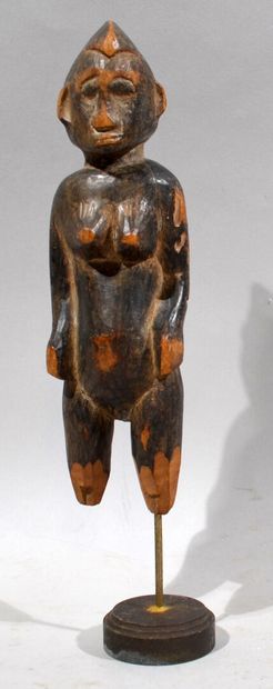 null AFRIQUE - COTE D'IVOIRE

Statuette de personnage féminin debout en bois sculpté,...