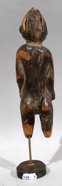 null AFRIQUE - COTE D'IVOIRE

Statuette de personnage féminin debout en bois sculpté,...
