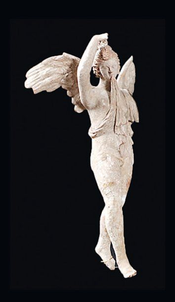 null Statuette en terre cuite modelée représentant un jeune homme ailé (EROS ?)....