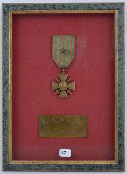 FRANCE. FRAME containing the war cross obtained...