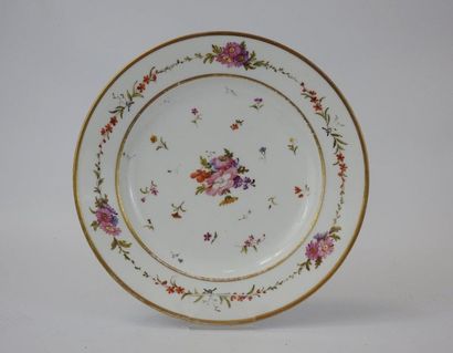 null Manufacture nationale de SEVRES : Polychrome porcelain plate with floral decoration....