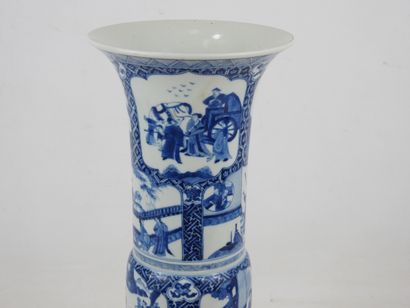 null CHINA - XIXth century: A white-blue porcelain "Gu" vase decorated with palace...