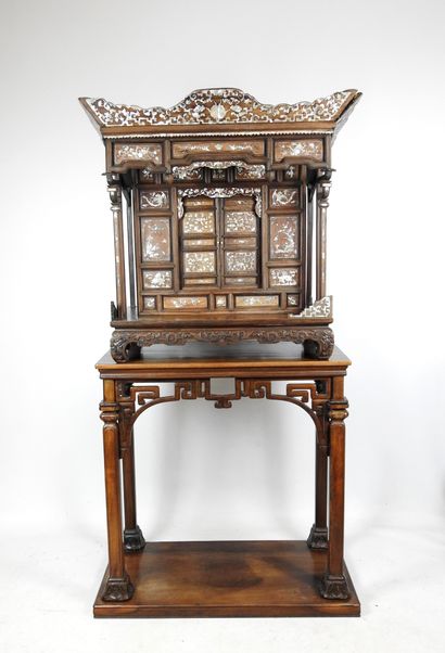 null Indochinese cabinet in exotic wood richly carved and inlaid with mother-of-pearl...