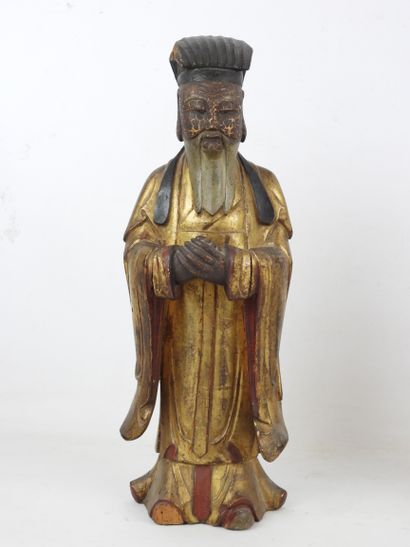 null CHINA - XIXth century : Two statuettes of standing dignitaries in gold lacquered...