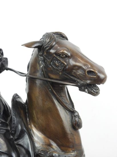 null Arab falconer on horseback. Modern proof in bronze with brown patina. After...