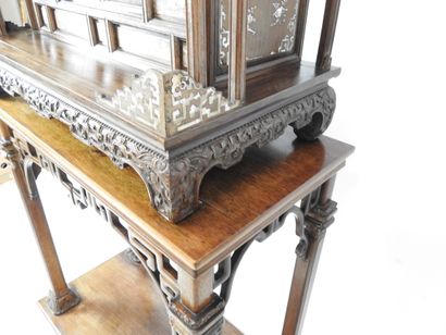 null Indochinese cabinet in exotic wood richly carved and inlaid with mother-of-pearl...