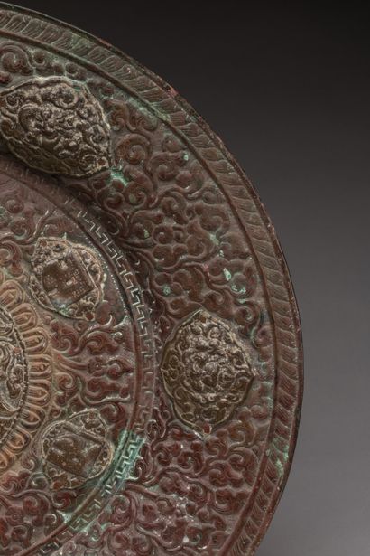 null TIBET.

Very old circular offering dish in chased and stamped copper decorated...