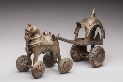 null INDIA, Bastar region.

Bronze votive statuettes on wheels showing two horses...