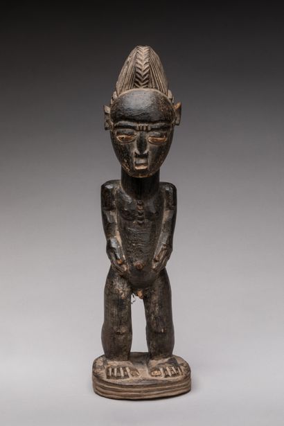 null Standing male statue, BAOULE, Ivory Coast.

Wood, black patina.

Height : 32...