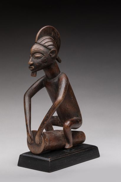null Statuette of a chief drummer, MBALA, Democratic Republic of Congo.

Wood, dark...