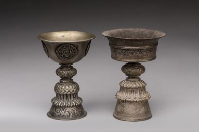 null TIBET.

Silver and silver alloy chased, patina of use.

Two butter lamps resting...