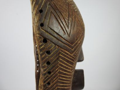 null SONGYE, Democratic Republic of Congo.

Carved and striated wood, pigments.

Female...