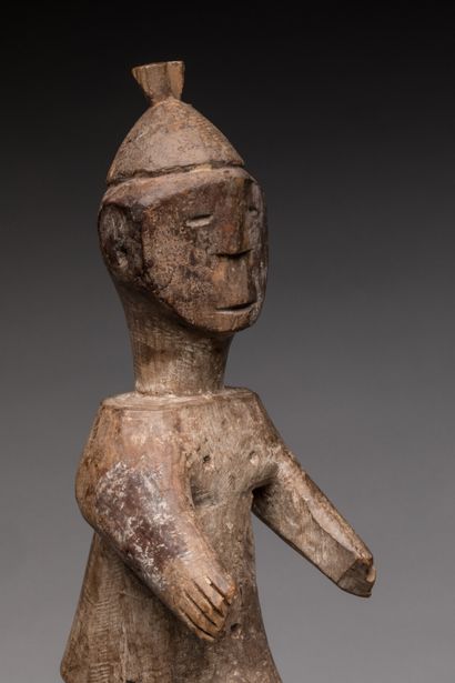 null TOGO.

Wood, white pigments.

Statue representing a stylized male figure, legs...