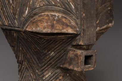 null Kifwebe" mask, SONGYE, Democratic Republic of Congo.

Wood, magic charge, raffia,...