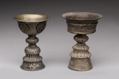 null TIBET.

Silver and silver alloy chased, patina of use.

Two butter lamps resting...
