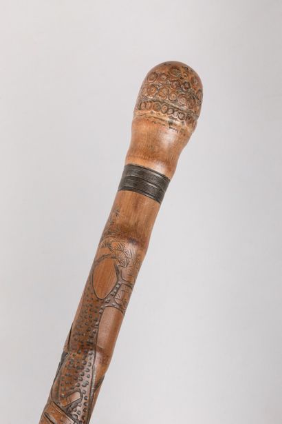 null JAPAN.

Bamboo cane richly engraved with Samurai figures.

Meiji Era (1868-1912).

Length:...