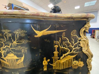 null A COMMODE with gold varnish decoration of lacustrian landscapes animated with...