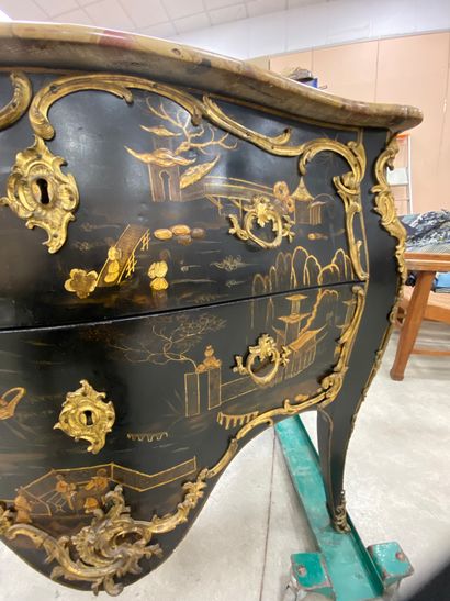 null A COMMODE with gold varnish decoration of lacustrian landscapes animated with...