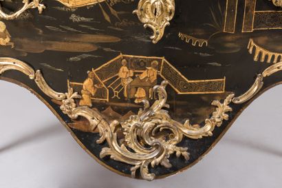 null A COMMODE with gold varnish decoration of lacustrian landscapes animated with...