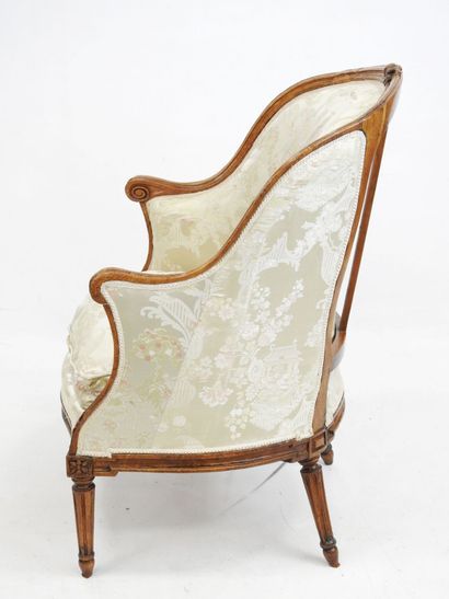 null A beechwood gondola shepherd's chair, molded and carved with flowers, fluted...