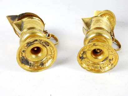 null PAIR OF BURETTES and its PLATE in gilded metal, chased and embossed with the...