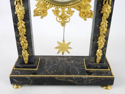 null PORTICAL HANGER in portor marble and rich ornamentation of chased and gilded...
