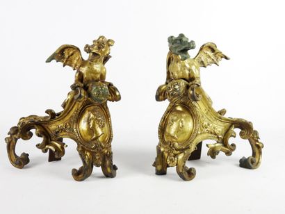 null PAIR OF CHENETS in chased and gilded bronze decorated with dragons with spread...