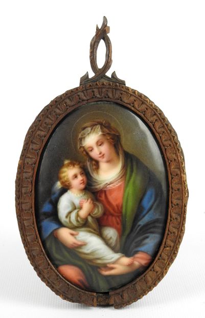 null PARIS : Porcelain medallion of oval form representing a Virgin and Child. Framed...