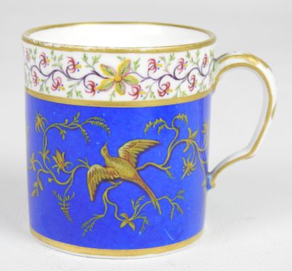 null SEVRES : Porcelain cup and saucer decorated with a bird on a blue background....
